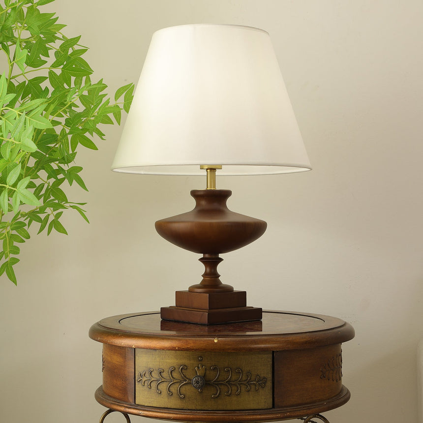 Close view of the white empire shade and the brass neck below it
