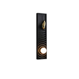 Black stained panel carved in ripples with a brass teardrop and a lit orb
