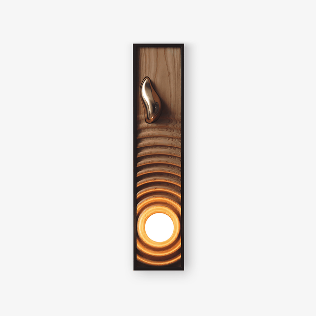 Oversized wall sconce, a tall black frame holding a rippled wood panel and a lit orb