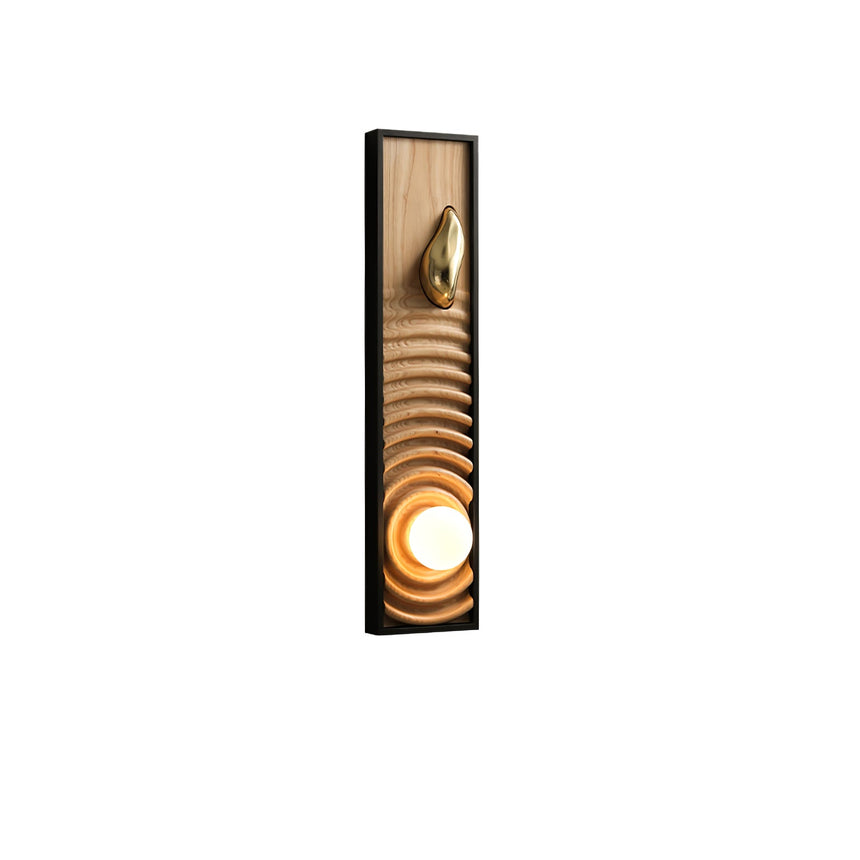 Light ash panel carved in ripples inside a black frame, the orb lit at the base