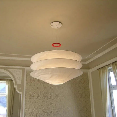 Layered paper shade seen from below under a white ceiling