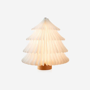 Paper table lamp opened into a white folding tree on a wood base