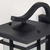 Close view of the curved hook arm and the flat top of the lantern