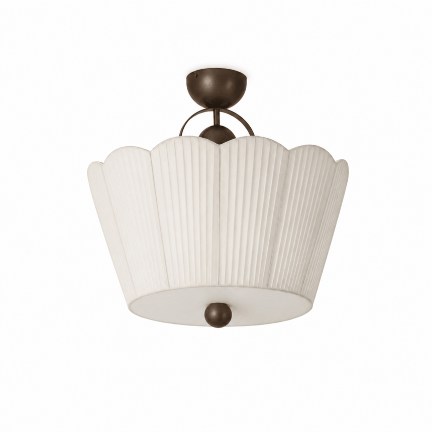 Pleated ceiling light seen close up, unlit, showing the scalloped petal outline