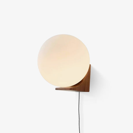 White glass sphere on an oak wall bracket, seen straight on unlit