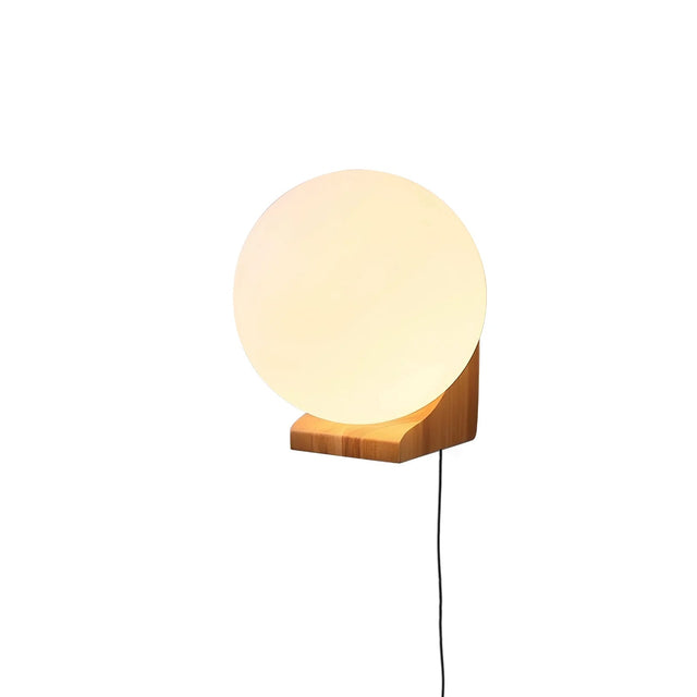 White glass orb lit on a small oak bracket with the cord hanging down