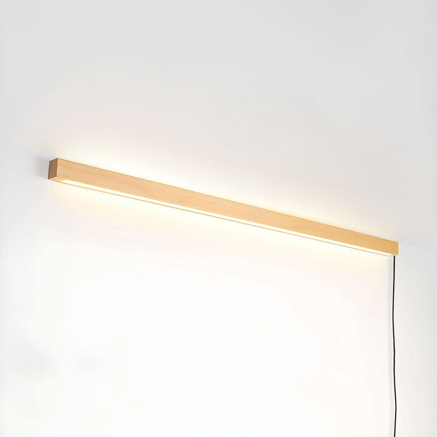 Pine bar lit horizontally with the cord running down from one end
