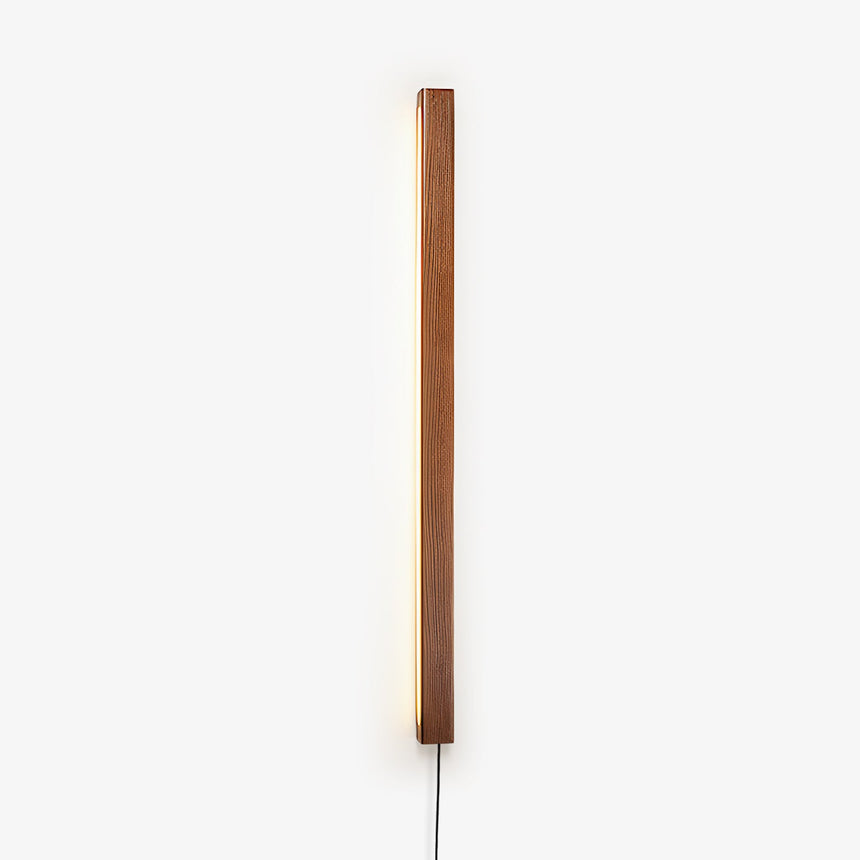 Slim walnut bar mounted vertically on a wall with its cord hanging down