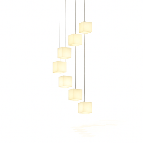 The same cascade of alabaster cubes lit, warm light through the stone
