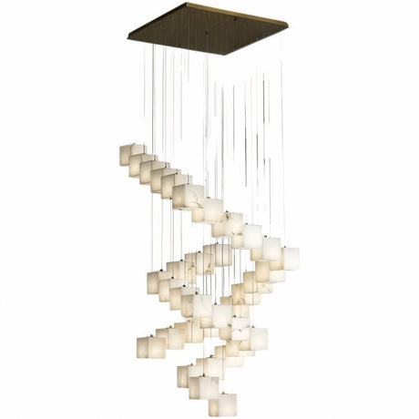 A long spiral of lit alabaster cubes dropping from a square brass plate