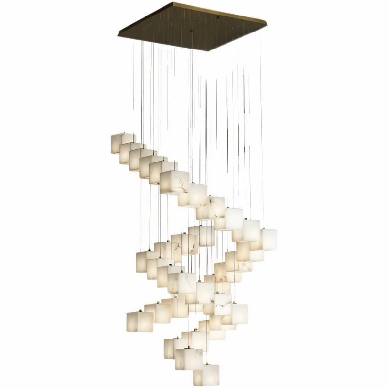 A long spiral of lit alabaster cubes dropping from a square brass plate