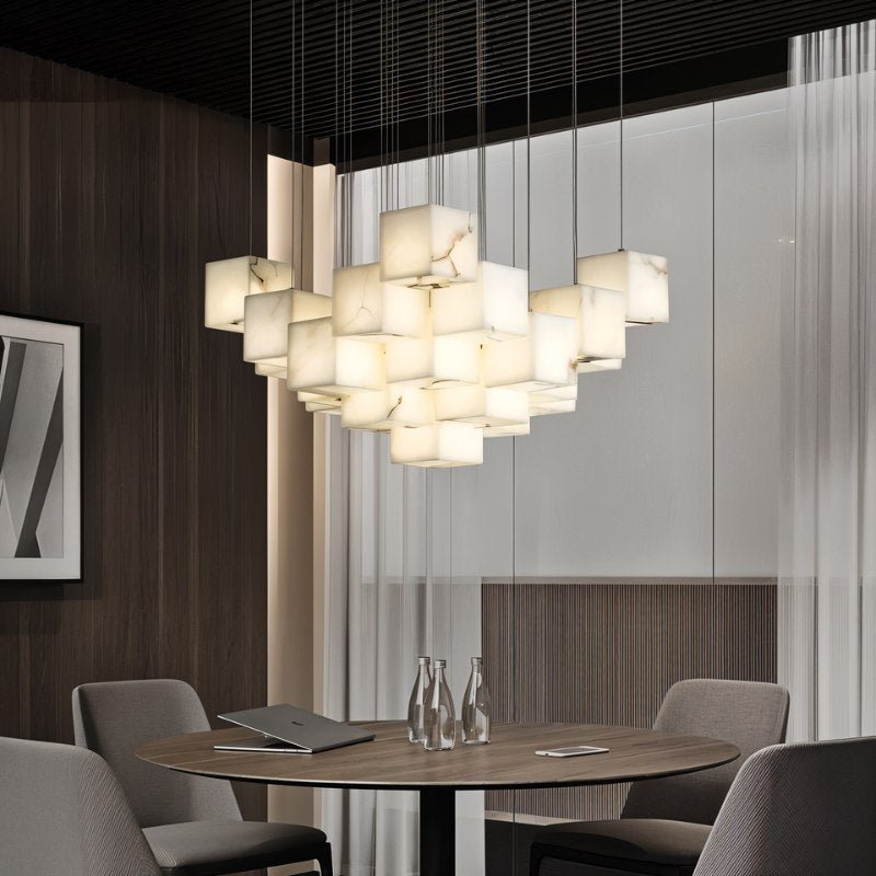 Lit cubes above a round table with chairs in a room with timber walls