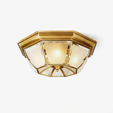 Polished brass ceiling light shaped as an octagonal bowl with frosted glass