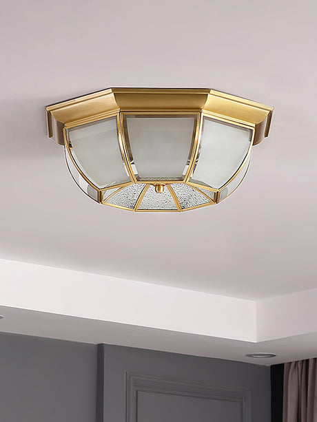 Octagonal brass ceiling light above a bedroom door frame