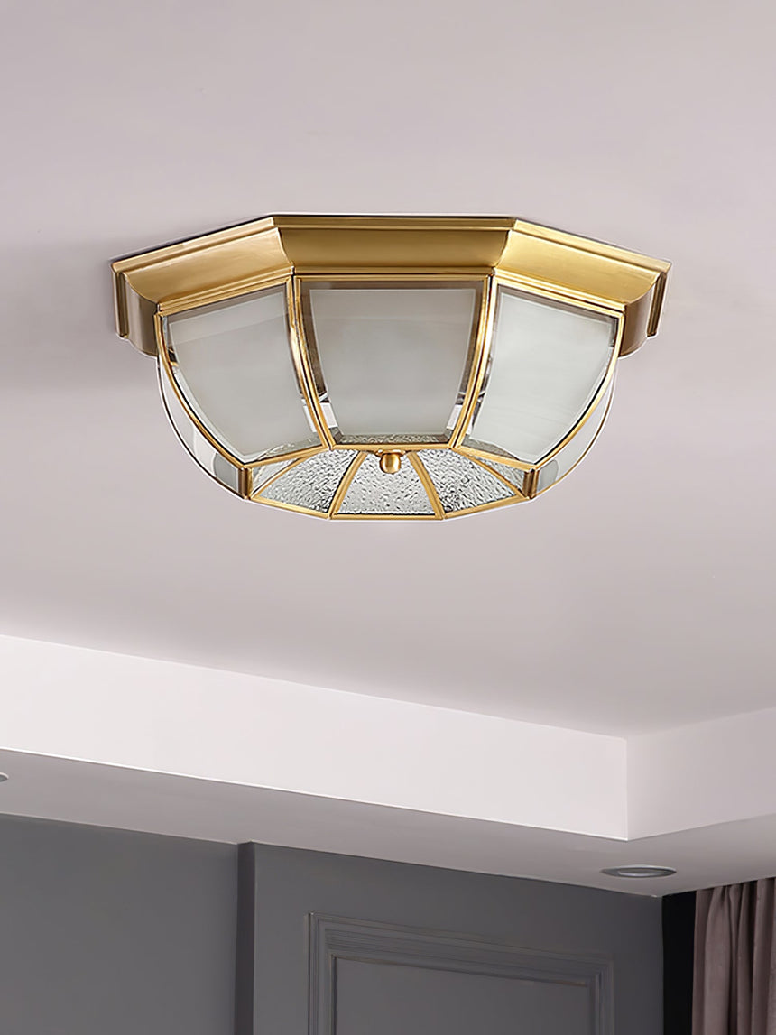 Octagonal brass ceiling light above a bedroom door frame