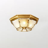 Smaller octagonal brass ceiling light on a pale backdrop
