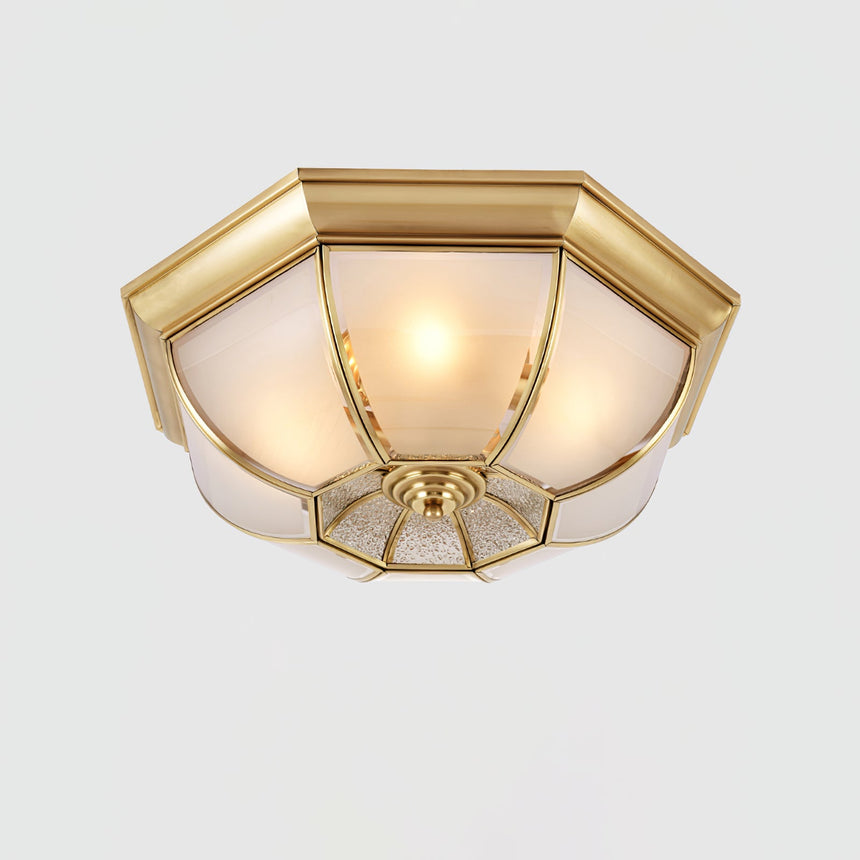 Octagonal brass ceiling light shown at an angle with frosted panels