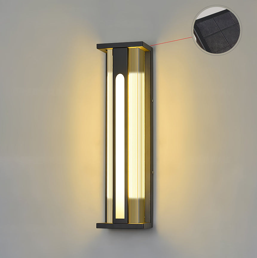 The solar version lit on a plain wall, a callout marking the cell on top