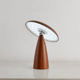 Close view of the lit disc face and the metal tilting joint