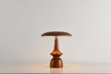 Portable table lamp on a turned spindle base, plain ground