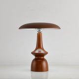 Portable table lamp on a spindle base seen from the front