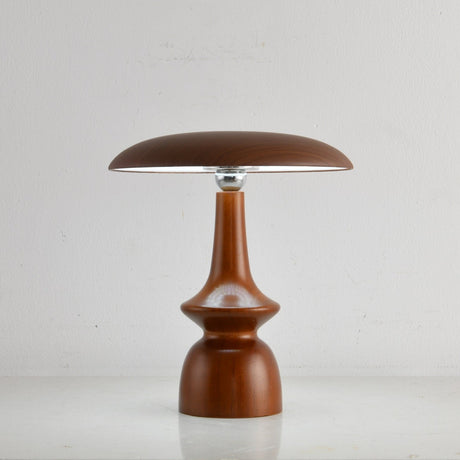 Portable table lamp on a spindle base seen from the front