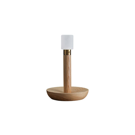 Portable table lamp in light wood standing on a plain white ground