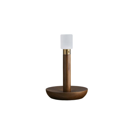Portable table lamp in walnut standing on a plain white ground