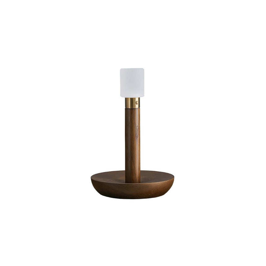 Portable table lamp in walnut standing on a plain white ground