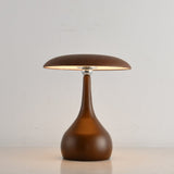 Portable table lamp on a teardrop base with the disc lit