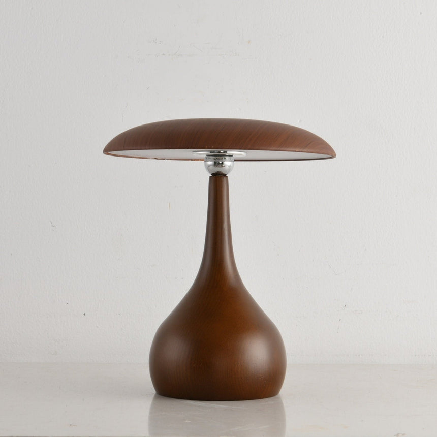 Portable table lamp on a teardrop base seen from the front