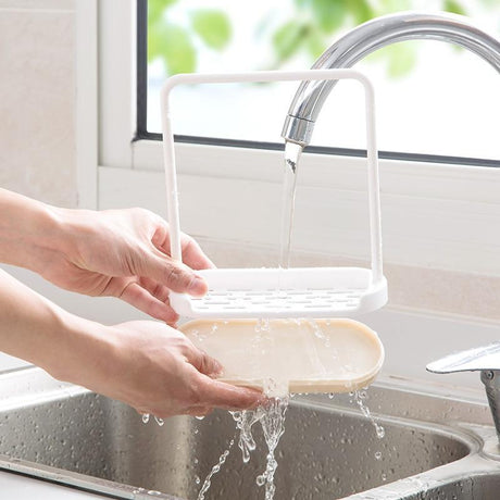 Dishcloth holder mounted near kitchen sink