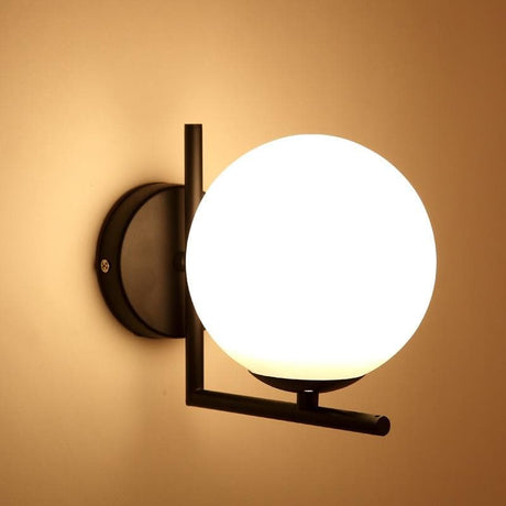 Black and brass wall sconce for home
