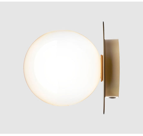 Globe Light Fixture Beside Fireplace Mantel