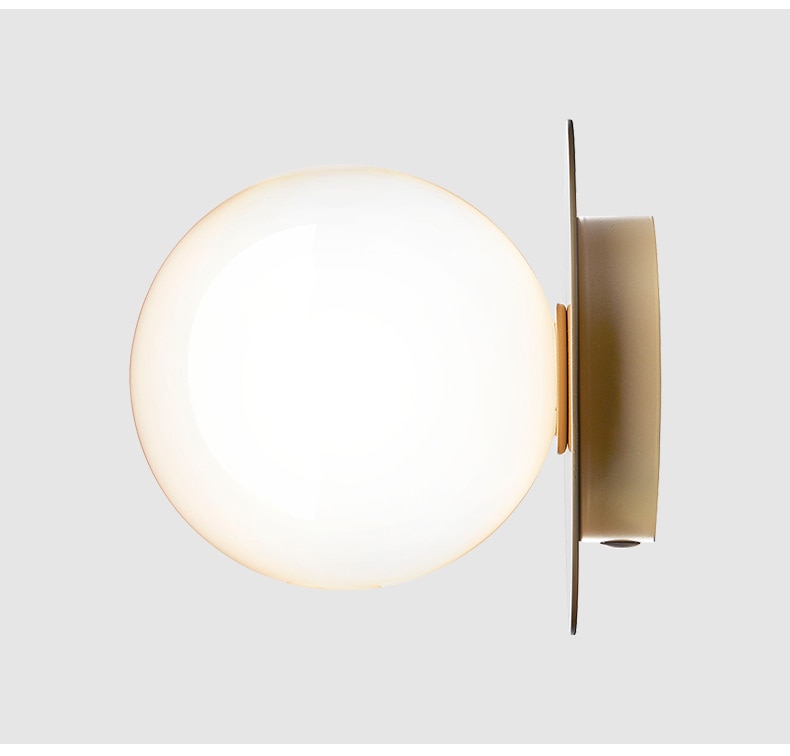 Globe Light Fixture Beside Fireplace Mantel