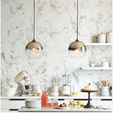 Aurell Glass Chandelier close-up – globe design | OroDwell