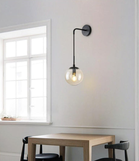 Suspended glass globe wall light