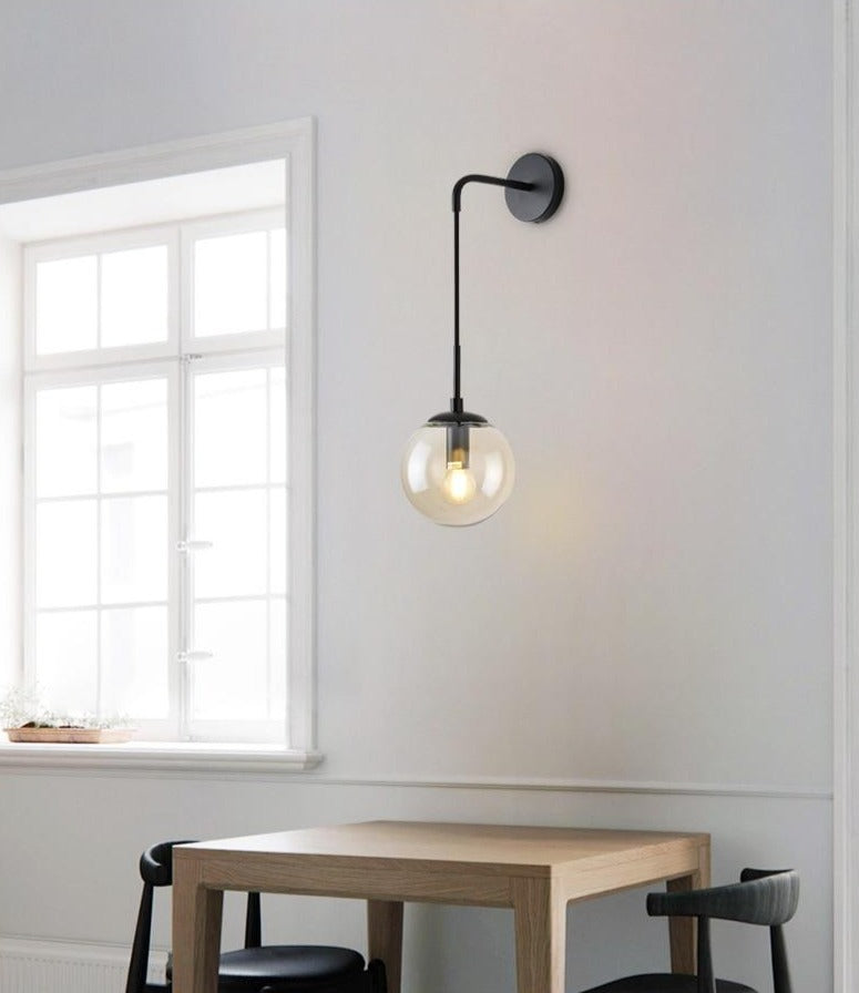Suspended glass globe wall light