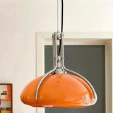 Close view of the chrome frame holding the orange glass shade