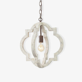 A quatrefoil frame of aged white wood around a single filament lamp on a chain
