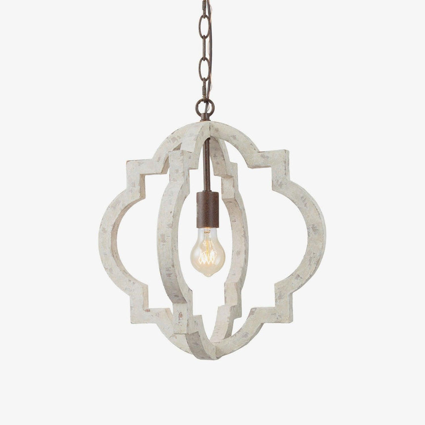 The quatrefoil frame and its lamp seen against plain white