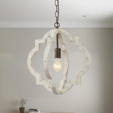 A single fitting lit against a soft green wall with a table below