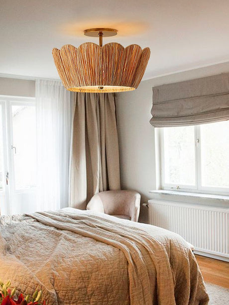 Raffia ceiling light above a bed with a woven blind and a tall curtain