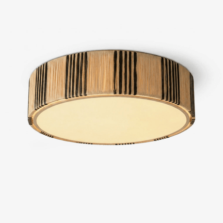 Raffia ceiling light with a striped woven drum shade and a brass rim