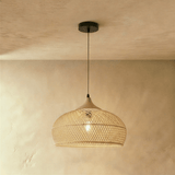 A natural shade with a flared open rim, light falling through the weave