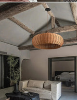 Low woven dome hung under exposed roof beams