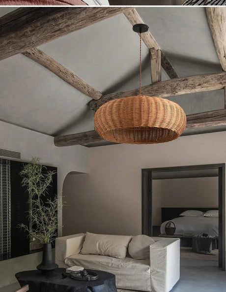 Low woven dome hung under exposed roof beams
