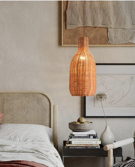 Tall teardrop woven shade beside a bed