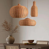 Round and teardrop woven shades above a dining table