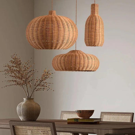Round and teardrop woven shades above a dining table